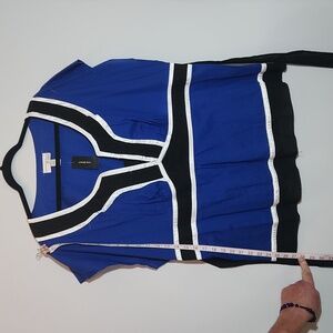 Blue tie back tunic trimmed in black and white